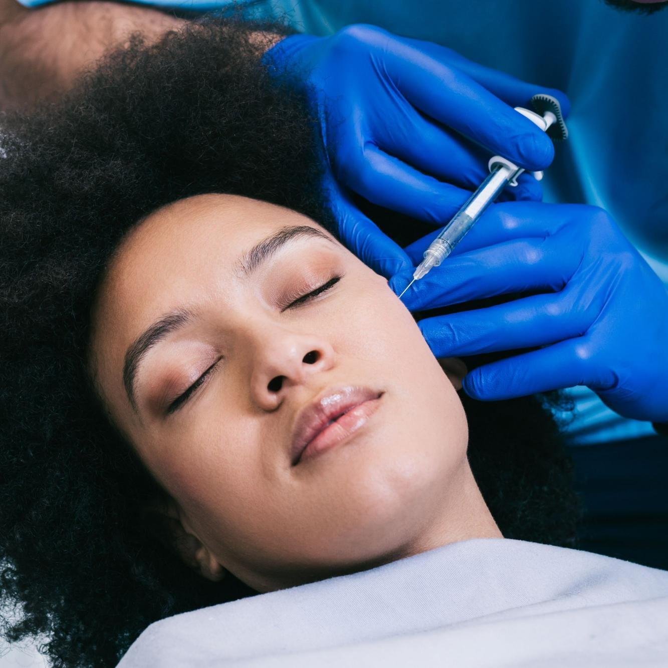 African Woman Getting Dermal Filler Injection on her Face | Sorelle Aesthetics in Orefield, PA